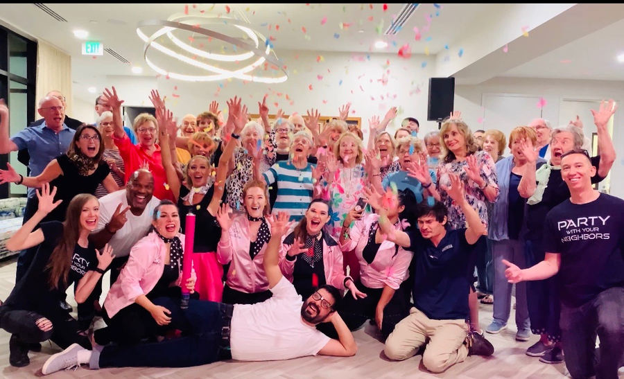 Residents celebrating in an apartment clubhouse